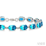 7X5 MM Oval Shape Blue Topaz and 1/10 Ctw Single Cut Diamond Semi-Precious Bracelet in Sterling Silver