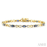 5x3 MM Oval Cut Sapphire and 1/10 Ctw Single Cut Diamond Bracelet in 10K Yellow Gold