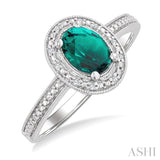 7X5 MM Oval Shape Lab-Created Emerald and 1/50 Ctw Round Cut Diamond Precious Ring in Sterling Silver