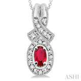 5x3 MM Oval Cut Ruby and 1/50 Ctw Round Cut Diamond Pendant in Sterling Silver with Chain