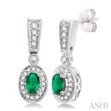 5x3mm Oval Cut Emerald and 1/3 Ctw Round Cut Diamond Earrings in 14K White Gold