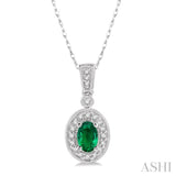 6x4mm Oval Cut Emerald and 1/8 Ctw Round Cut Diamond Pendant in 14K White Gold with Chain