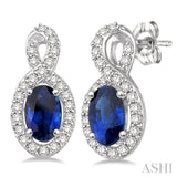 5x3 MM Oval Cut Sapphire and 1/5 Ctw Round Cut Diamond Earrings in 10K White Gold