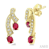 4x3MM Oval Cut Ruby and 1/5 Ctw Round Cut Diamond Earrings in 14K Yellow Gold