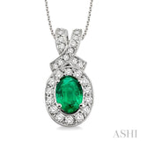 7x5mm Oval Cut Emerald and 5/8 Ctw Round Cut Diamond Pendant in 14K White Gold with chain